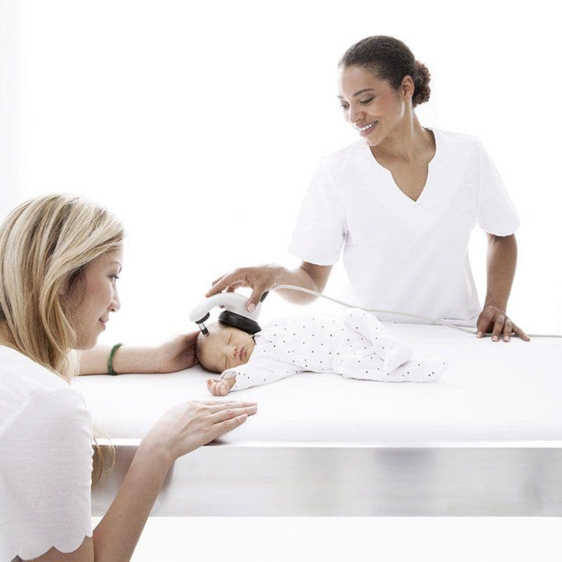 Doctor testing a sleeping baby with the MAICO MB 11 BERAphone while the mother is watching